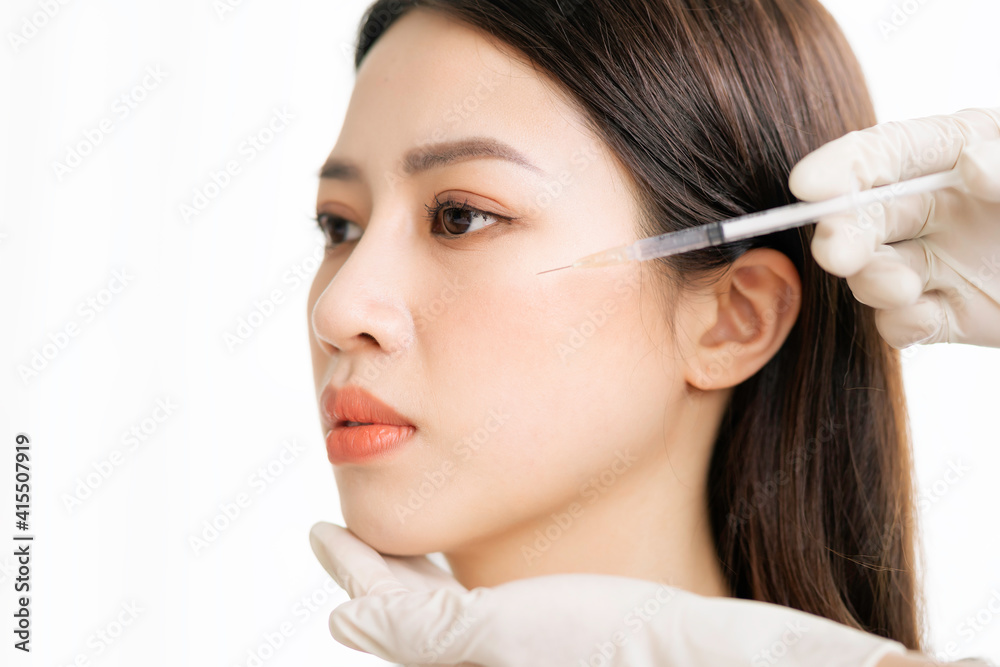 Asian woman undergoing fine carpet surgery Asian woman undergoing fine carpet surgery