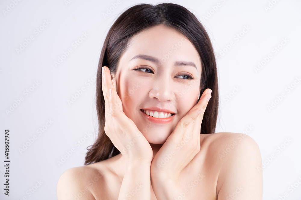 Beautiful xing woman with fresh skin smiling on background Beautiful xing woman with fresh skin smiling on background