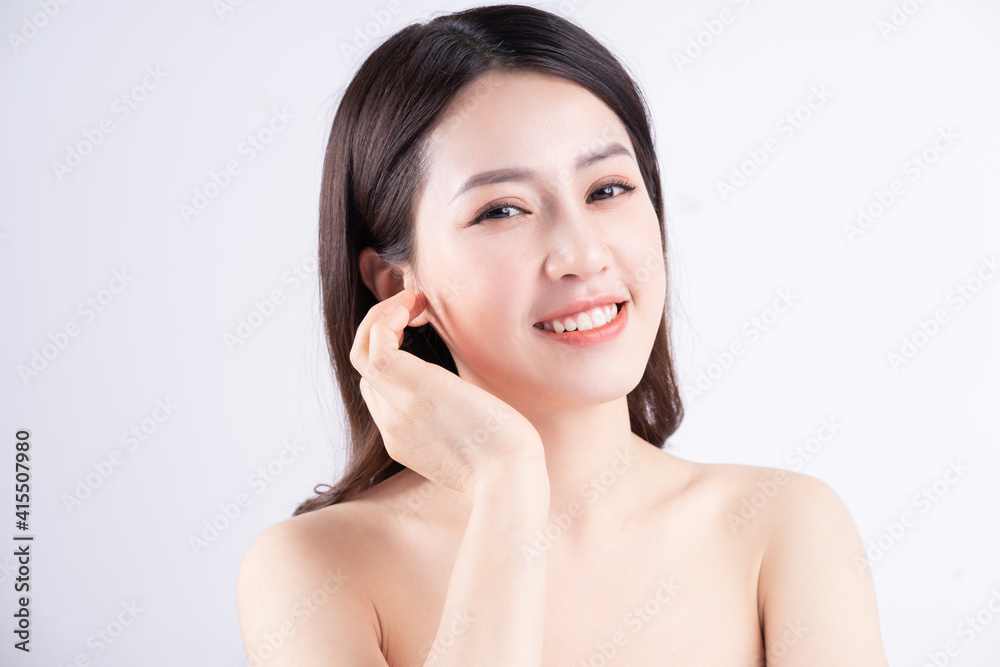 Beautiful xing woman with fresh skin smiling on background Beautiful xing woman with fresh skin smiling on background