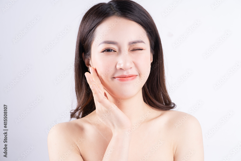 Beautiful xing woman with fresh skin smiling on background Beautiful xing woman with fresh skin smiling on background