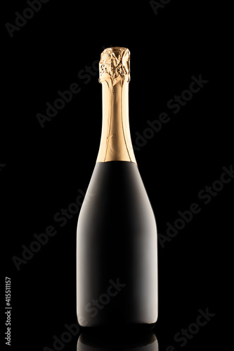 silhouette of closed bottle of champagne without label isolated on black background