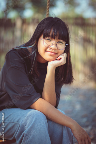 casual style of asian teenager relaxing outdoor