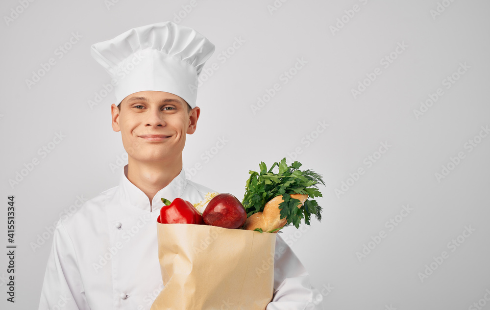 chef with a food package in food preparation professional restaurant chef with a food package in food preparation professional restaurant