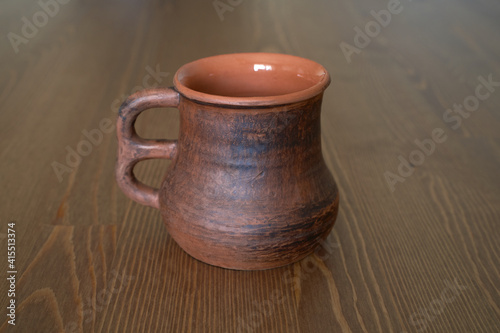 Ceramics, ceramic product mug with your own hands, made on a potter's wheel © nikolay_alekhin