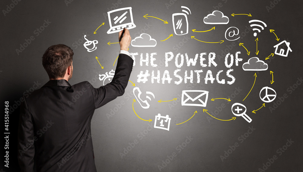 businessman drawing social media icons with THE POWER OF #HASHTAGS inscription, new media concept businessman drawing social media icons with THE POWER OF #HASHTAGS inscription, new media concept