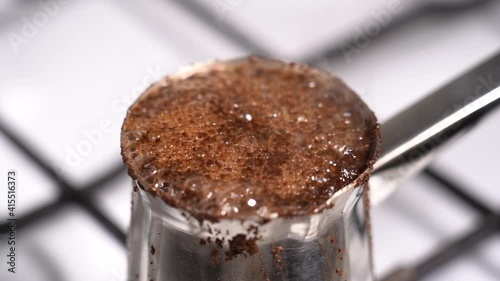 Boiling coffee while preparation in turkish coffee pot