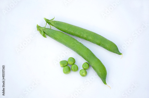 the ripe green peas with grain isolated on white background.
