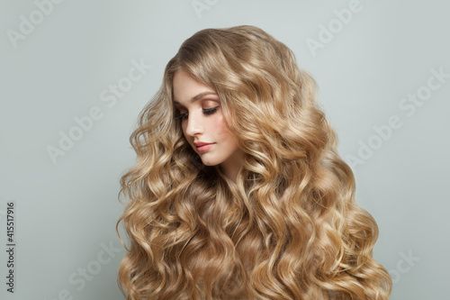 Blonde woman with long healthy hair, haircare concept