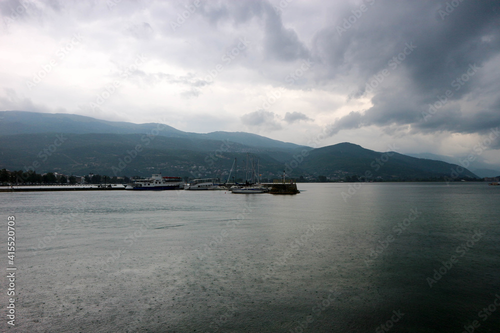 view of the city of Ohrid on the coast of the lake in North macedonia in rainy weather