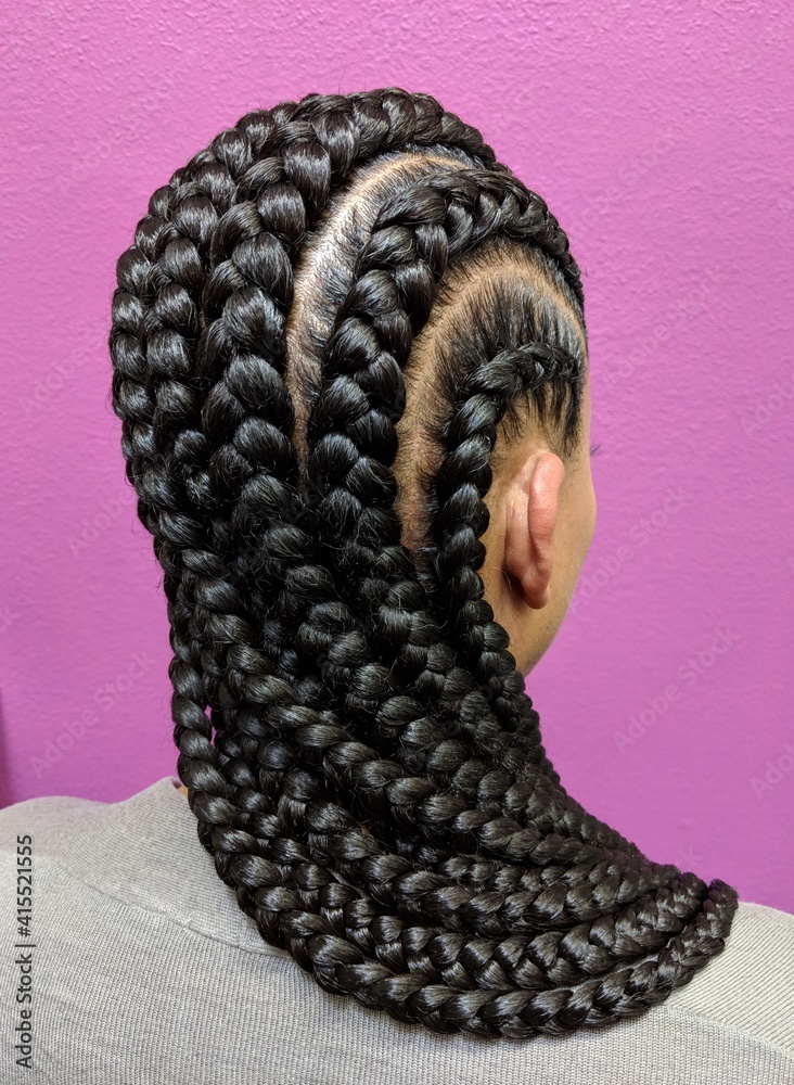 Afro Hair Braided In A Cornrow Hairstyle Using Synthetic Hair Extensions With Purple Color Background
 - obrazy, fototapety, plakaty 