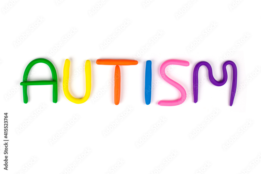 Multicolored letters made of play-doh or other playfoam isolated on white background - World Autism Awareness Day concept. Autism spectrum disorder and child mental health concept, selective focus
