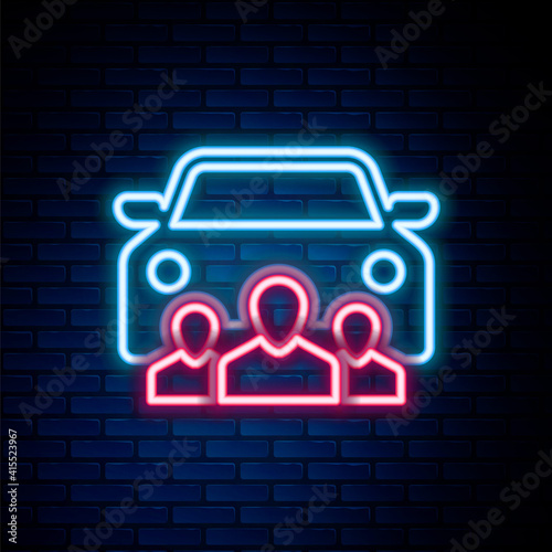Glowing neon line Car sharing with group of people icon isolated on brick wall background. Carsharing sign. Transport renting service concept. Colorful outline concept. Vector.