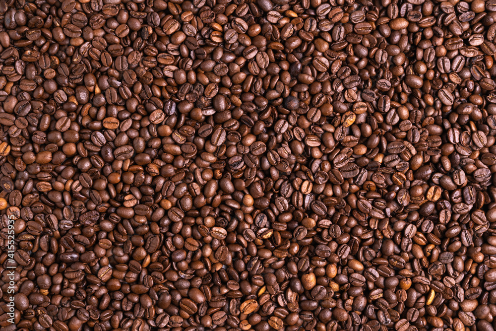Roasted black coffee beans background. Top view, backdrop