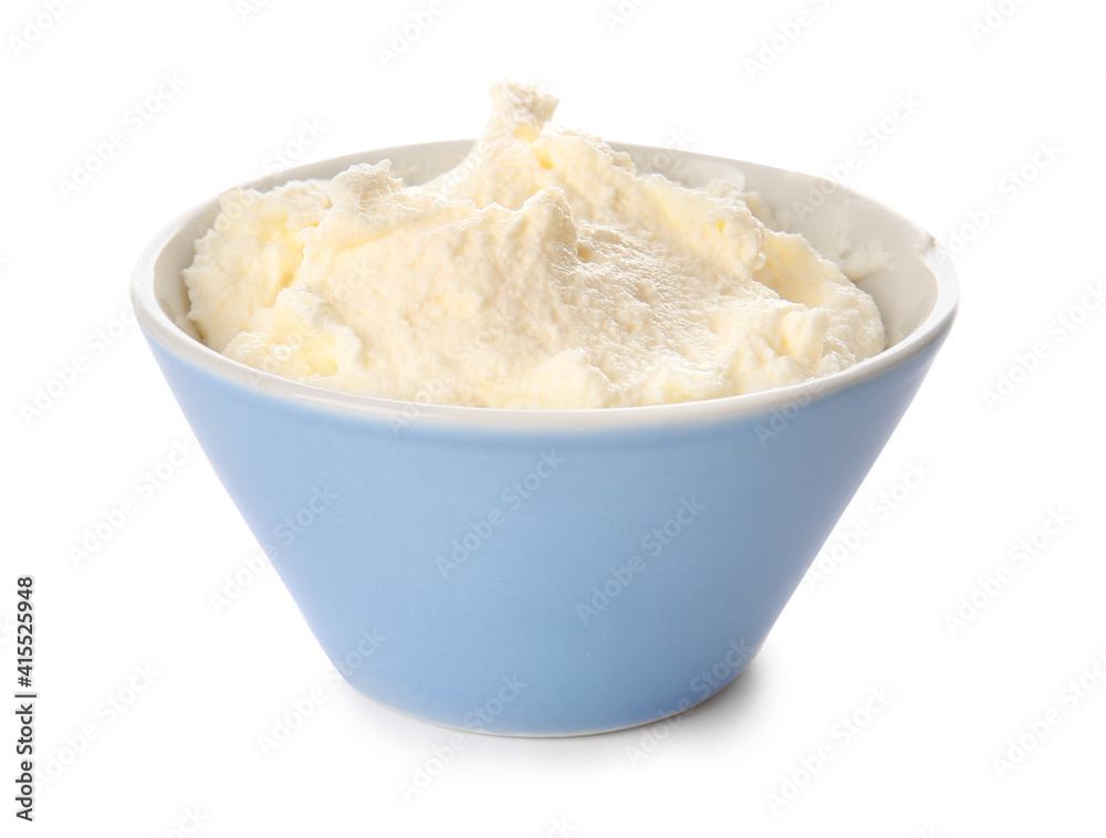 Bowl with tasty cream cheese on white background