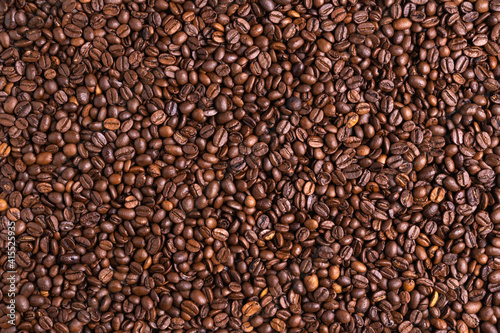 Roasted black coffee beans background. Top view, backdrop