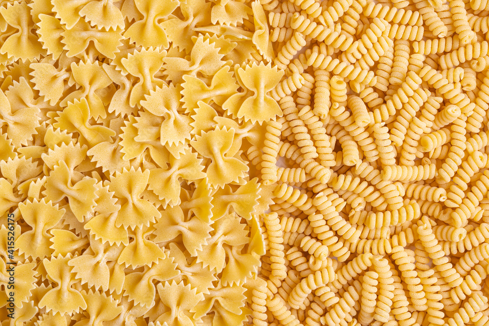 Farfalle and fusilli pasta, backgrond. Top view Farfalle and fusilli pasta, backgrond. Top view