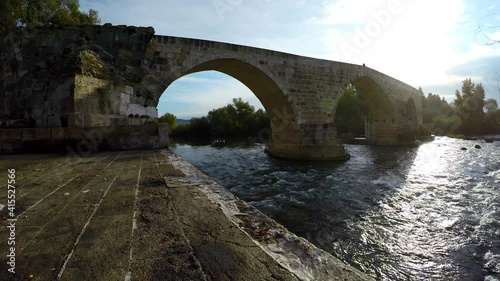 Historical Aspendos Belkis bridge, built by the Seljuk turks on the piers of the previous ancient roman one. Turkey. Antalya. 