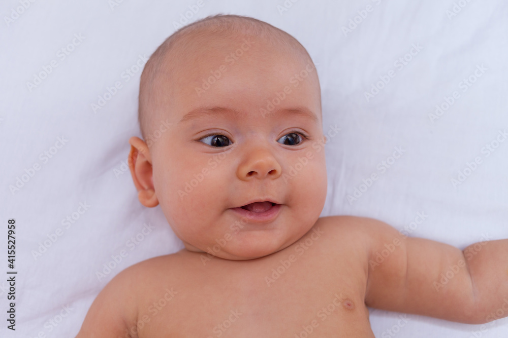 Portrait of a baby lying on the bed Portrait of a baby lying on the bed