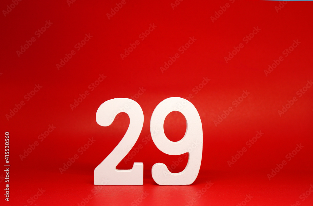 Twenty Nine ( 29 ) white number wooden Isolated Red Background with Copy Space - New promotion 29% Percentage Business finance Concept Twenty Nine ( 29 ) white number wooden Isolated Red Background with Copy Space - New promotion 29% Percentage Business finance Concept