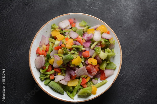 Frozen vegetable mixture of carrots, broccoli ,peppers, red onion and peas. Healthy food