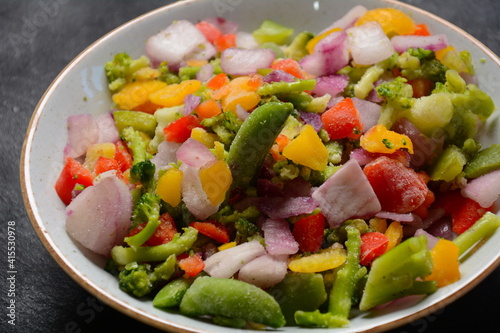 Frozen vegetable mixture of carrots, broccoli ,peppers, red onion and peas. Healthy food