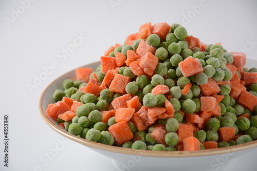 Frozen vegetable mixture of carrots and peas. Healthy food