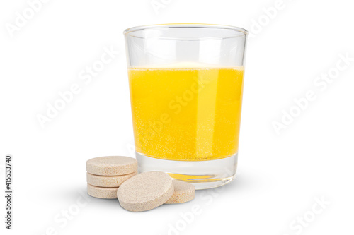 Fotografi Orange flavored vitamin c effervescent tablet and dissolve in glass of water islated on white background with clipping paths