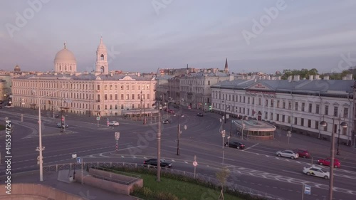 Aerial View on Saint-Petersburg Tuchkov Bridge and Vasilievski Island Embankment with Evening Traffic on Sunset photo