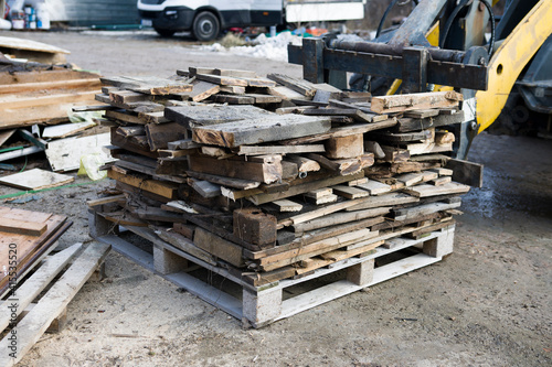 Stacking waste wood on a pallet