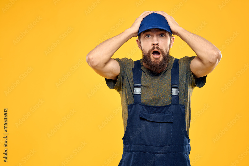 working man in uniform professional delivery service yellow background working man in uniform professional delivery service yellow background
