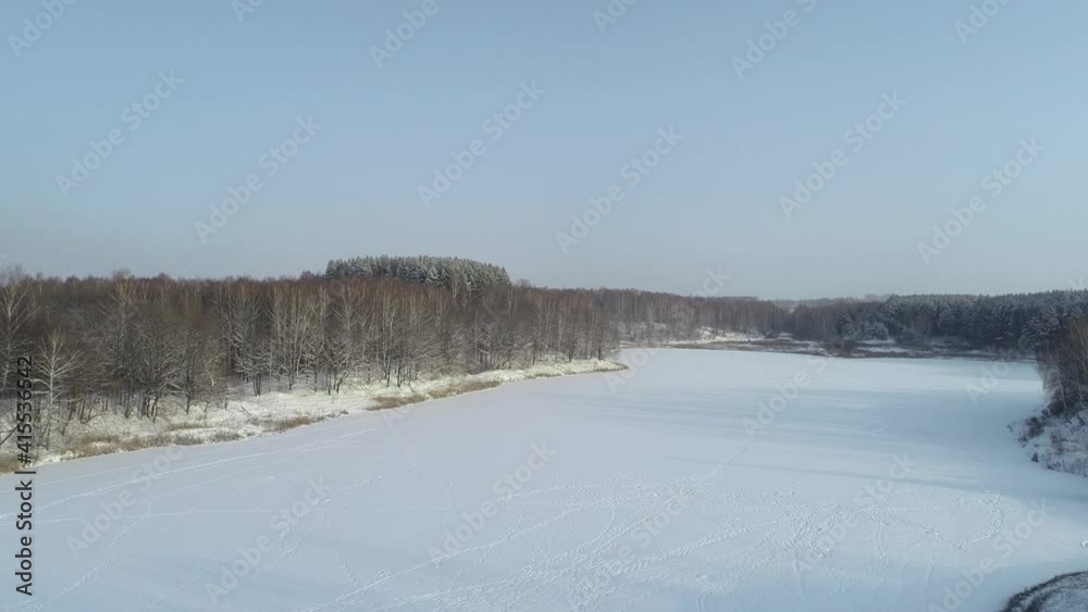 Forest in the snow, flying over frozen trees and fields Forest in the snow, flying over frozen trees and fields