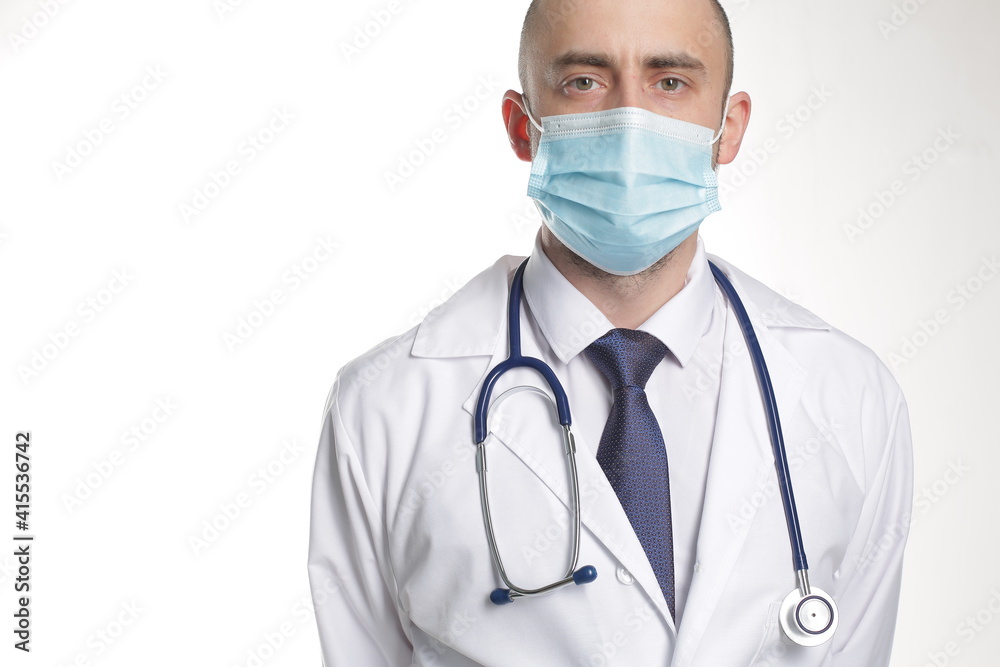 Doctor in Protective Mask with stethoscope in protective mask in hospital