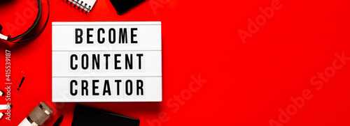 Leght box become content creator on red abstract background . Content creators and online education concept. Top horizontal view copyspace. photo