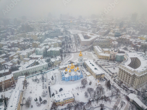 St. Michael's Cathedral in Kiev in a blizzard. Aerial drone view. Snowy winter morning, blizzard.