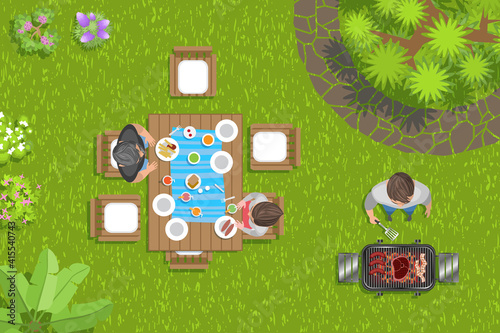 Group of friends making barbecue in the backyard. (Top view) 
People relax and dine in the garden. (View from above)