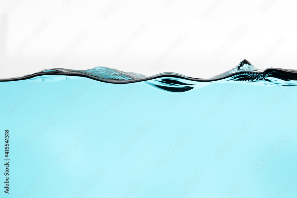 light blue water splash with bubbles of air, isolated on the white background. Giving a clear and clean feeling movement of the waves. in portrait orientation light blue water splash with bubbles of air, isolated on the white background. Giving a clear and clean feeling movement of the waves. in portrait orientation