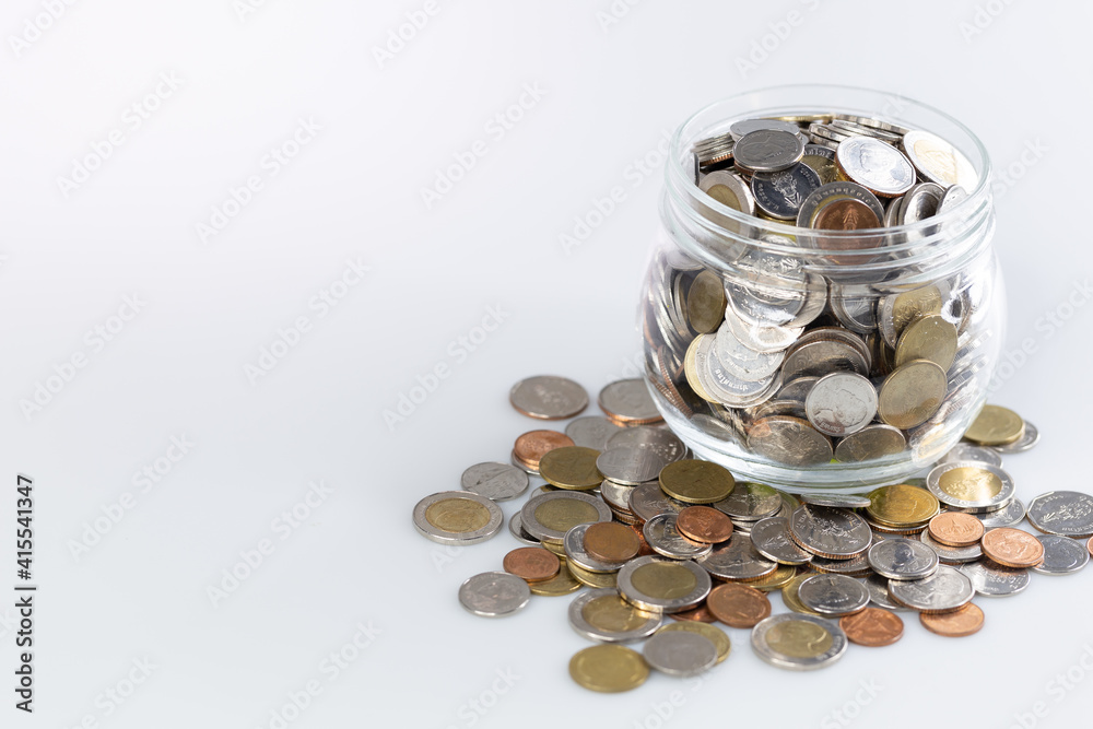Thai Coins in grass jar isolated on white background. This image for background. Thai Coins in grass jar isolated on white background. This image for background.