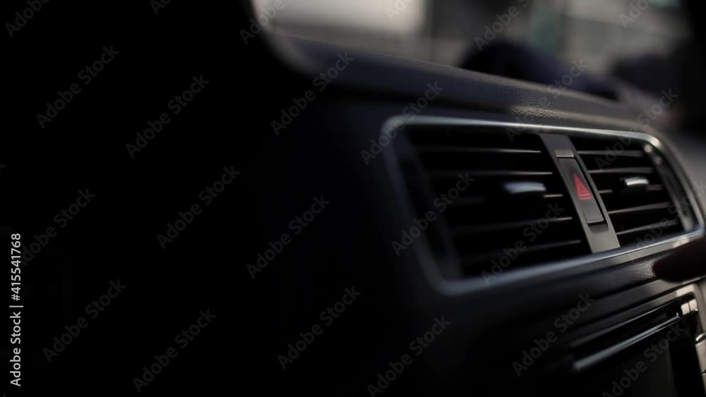 Close-up of male hand, pressing the emergency button in car. Copy space concept. Close-up of male hand, pressing the emergency button in car. Copy space concept.