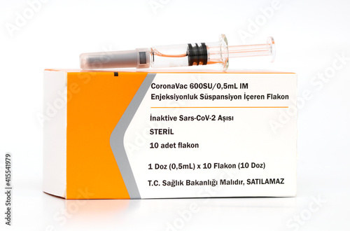Turkey, February, 2021. A box of vials vaccine with an injection syringe of Covid 19 immunization vaccines photo