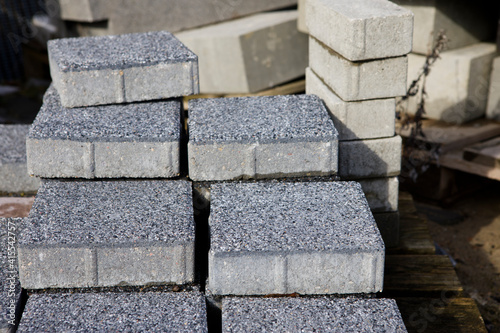Pavement-Stacks of new concrete paving slabs on wooden pallets