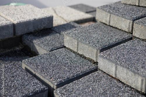 Pavement-Stacks of new concrete paving slabs on wooden pallets