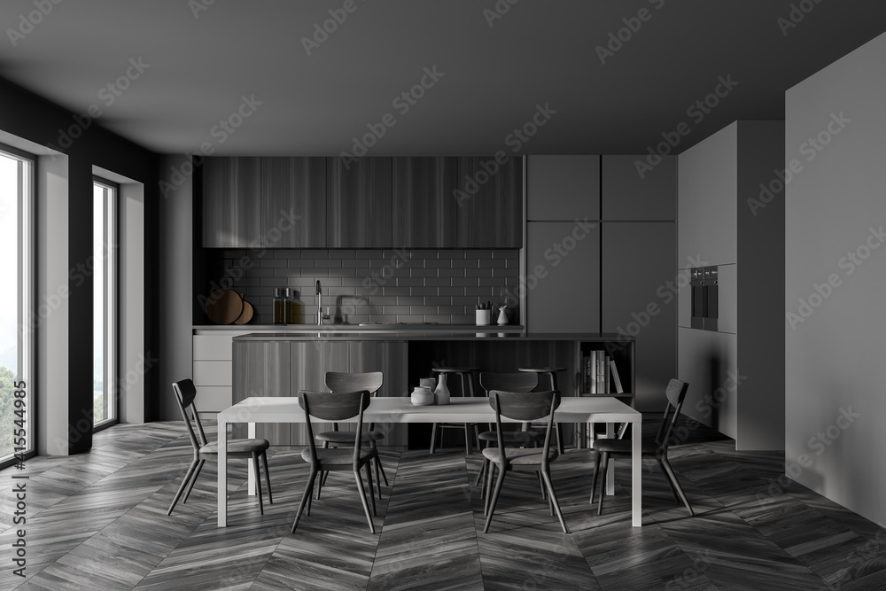 Dark grey kitchen set with eating table and chairs, window and black parquet Dark grey kitchen set with eating table and chairs, window and black parquet