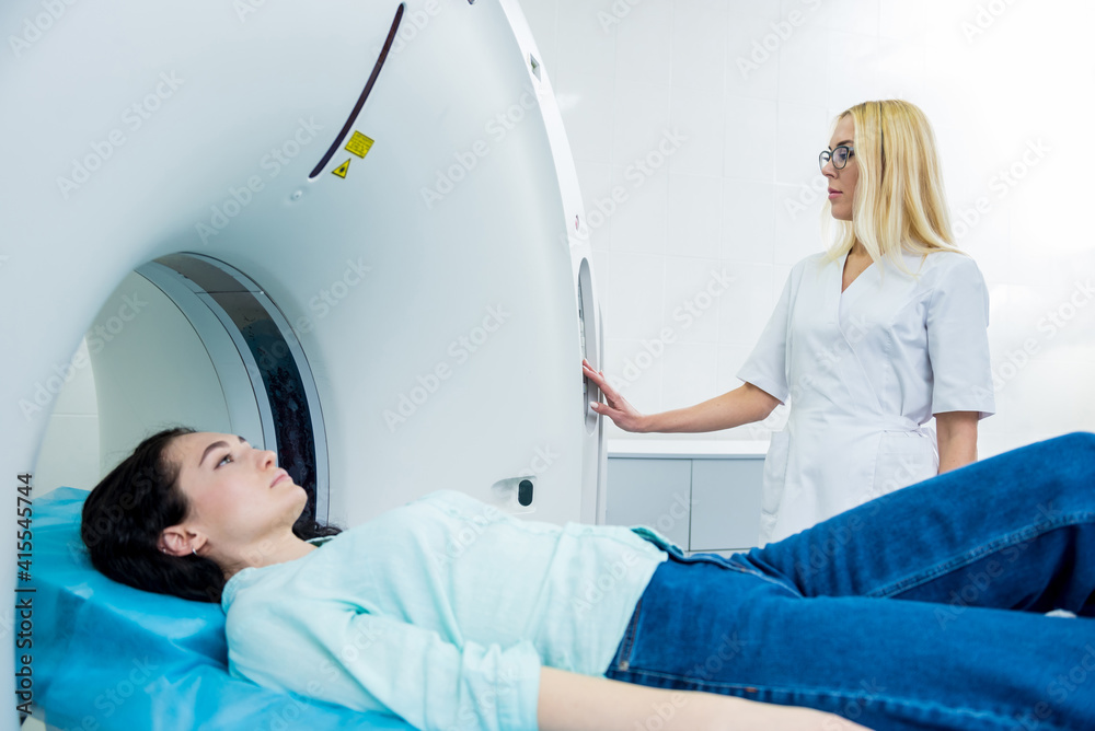 Doctor and patient in the room of computed tomography at hospital Doctor and patient in the room of computed tomography at hospital