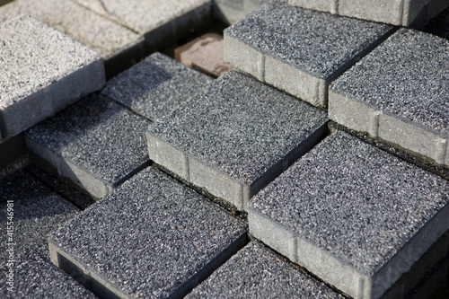 Pavement-Stacks of new concrete paving slabs on wooden pallets