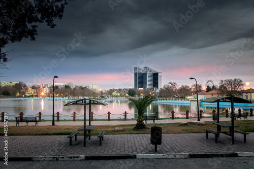 cityscape photo of the centre town of setif ,algeria beside the park mall with clouds and sunset