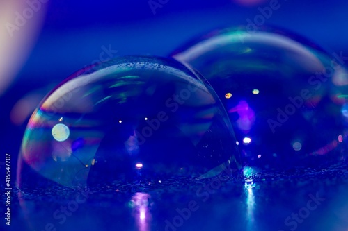 Abstract background soap bubbles on blue purple surface