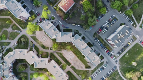 Drone view of a green blocks of flats. Geometrical cityscape. Strange buildings from above.
