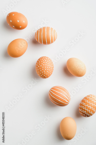 Simple Easter egg set on white background. Flat lay, top view, vertical. Minimal style.