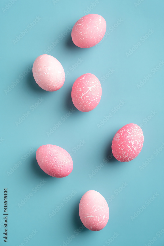 Pink Easter eggs turquoise background. Minimal style. Flat lay, top view, vertical Pink Easter eggs turquoise background. Minimal style. Flat lay, top view, vertical