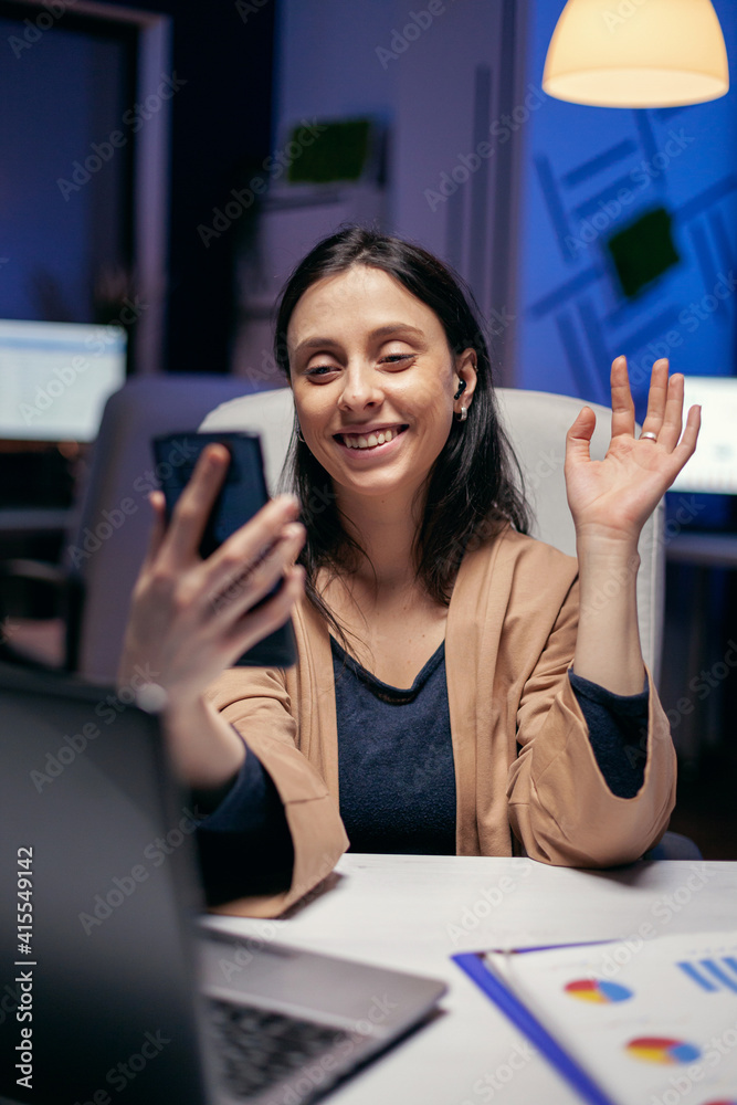 Saying hello in the course of teleconference with entrepreneurs doing ...